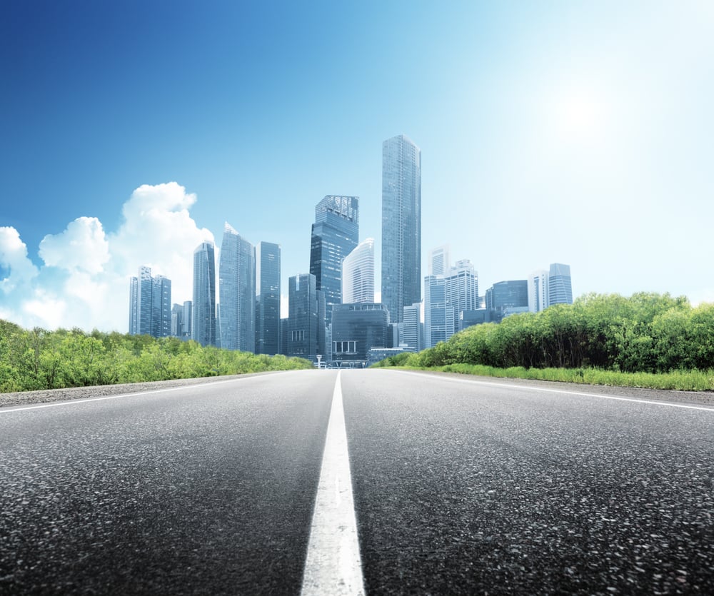 Asphalt road and modern city Asphalt road and modern city